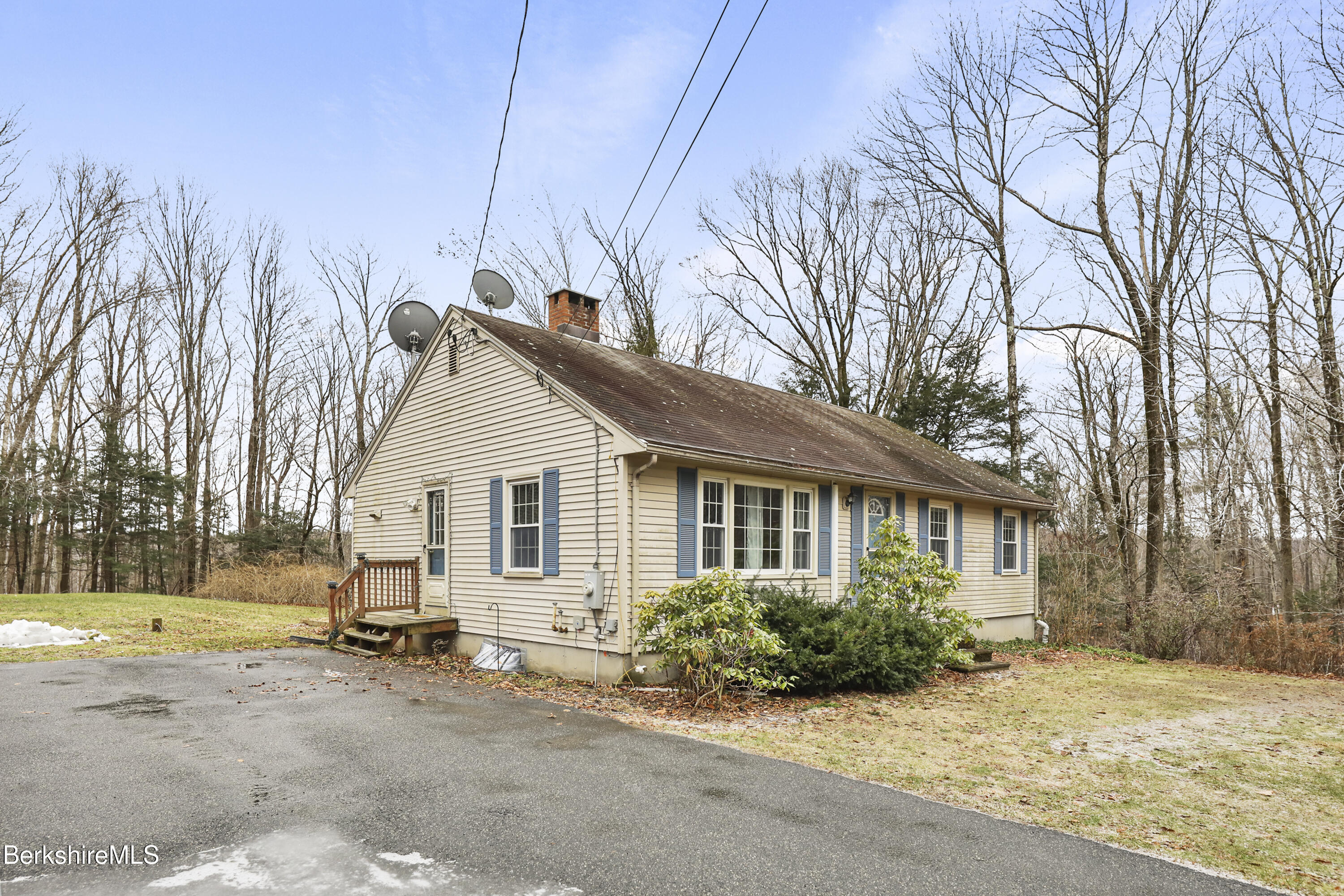 2271 Jacobs Ladder Road Becket, MA 01223 - Photo 2 of 28 a view of a house with a yard covered in snow
