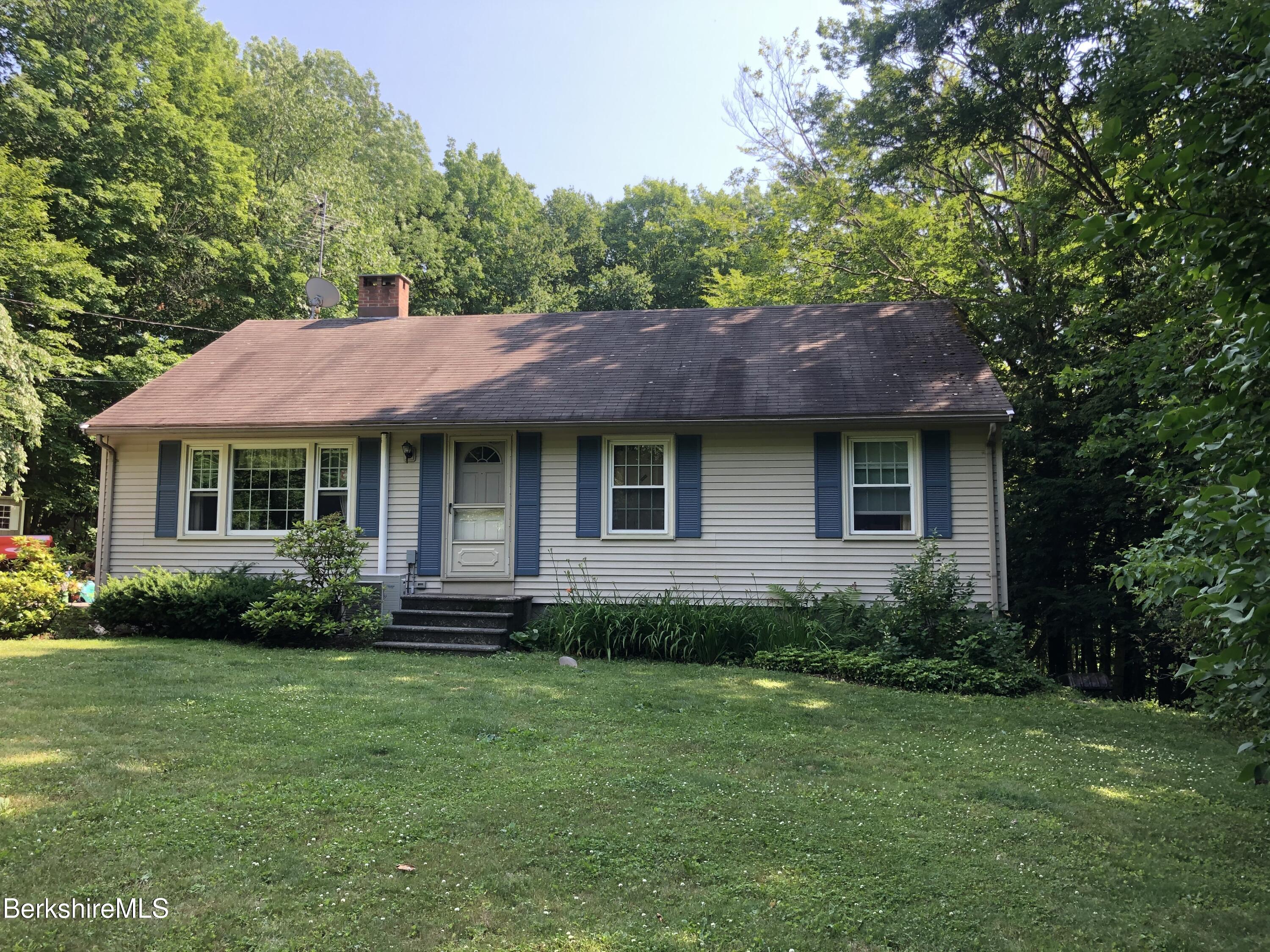 2271 Jacobs Ladder Road Becket, MA 01223 - Photo 3 of 28 a view of a house with a yard and sitting area