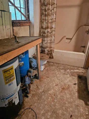 a view of a wooden deck front of house