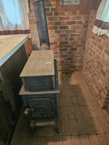 a view of a fireplace with wooden floor