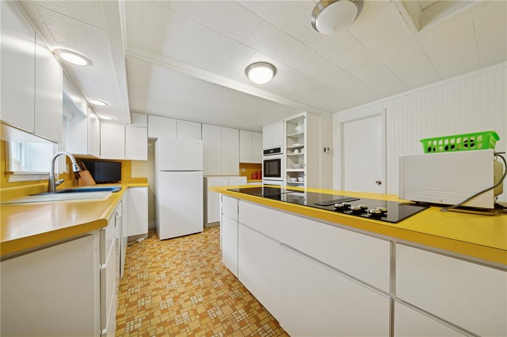 4314 Rostosky Ridge Road Monongahela, PA 15063 - Photo 11 of 38 a kitchen that has a lot of cabinets and wooden floor