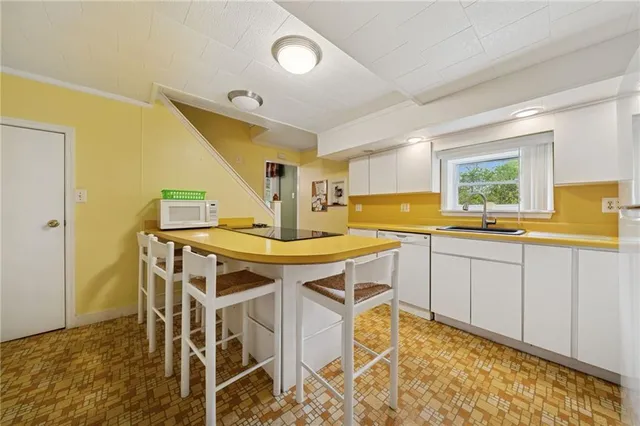 a kitchen with a table and chairs in it