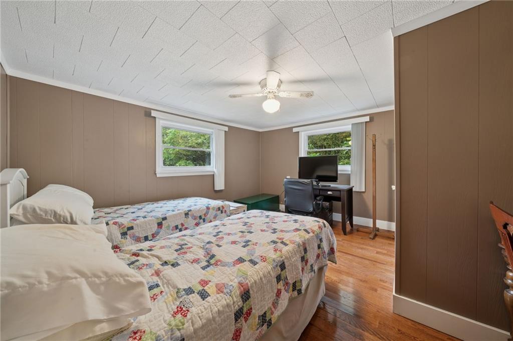 4314 Rostosky Ridge Road Monongahela, PA 15063 - Photo 19 of 38 a bedroom with a bed and a chandelier