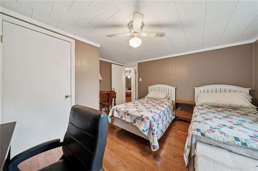 4314 Rostosky Ridge Road Monongahela, PA 15063 - Photo 20 of 38 a bedroom with a bed and a chandelier