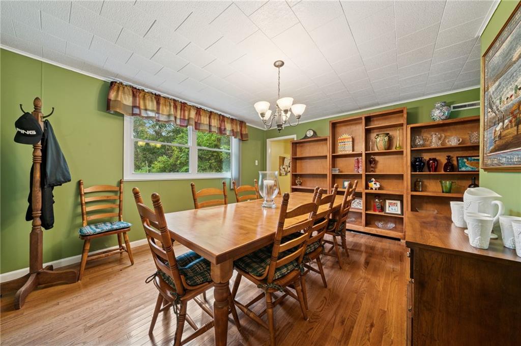4314 Rostosky Ridge Road Monongahela, PA 15063 - Photo 7 of 38 a view of a dining room with furniture and a chandelier