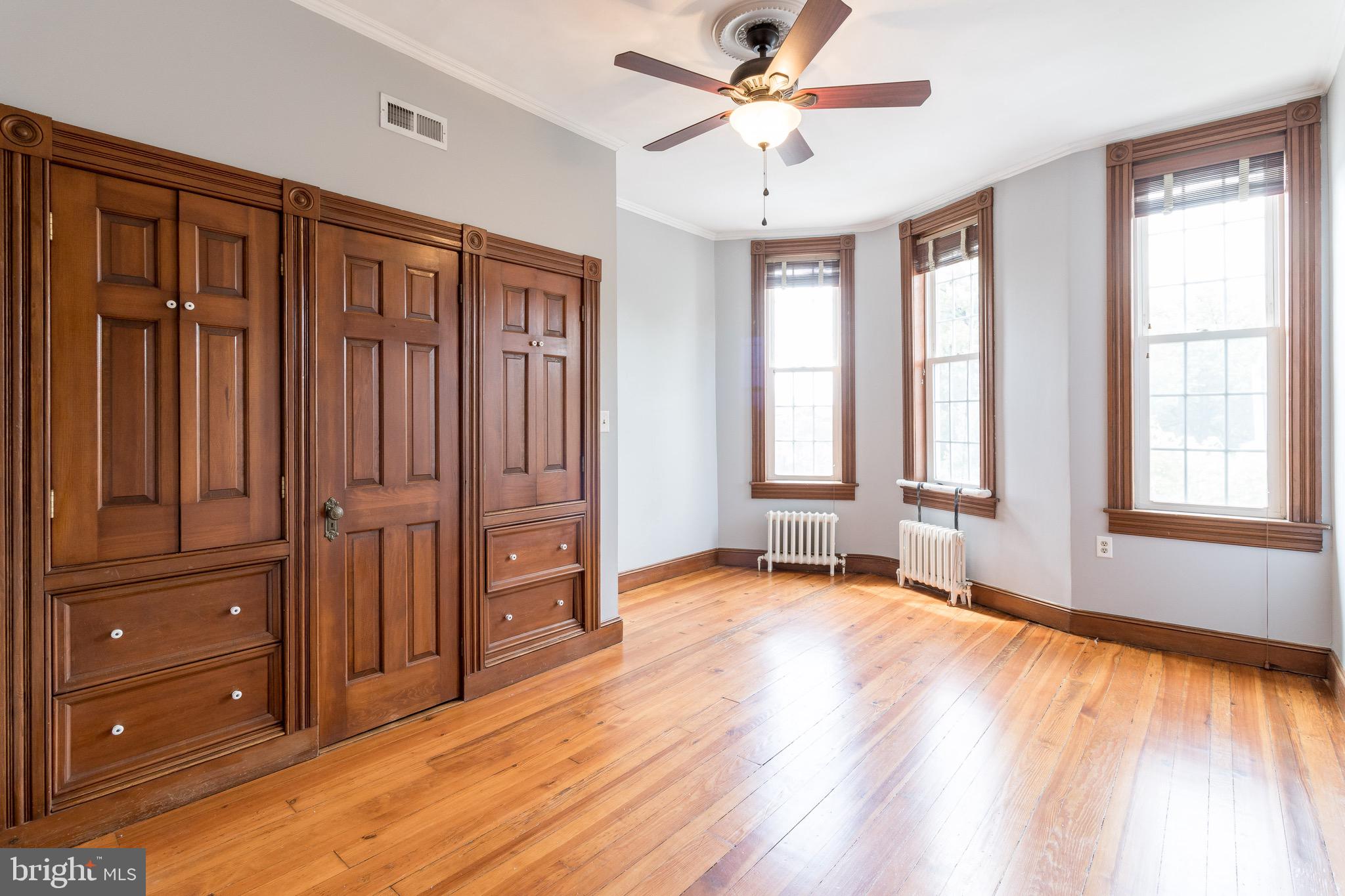 436 East Randall Street Baltimore, MD 21230 - Photo 23 of 37 Bedroom 1, featuring built ins and wood floors