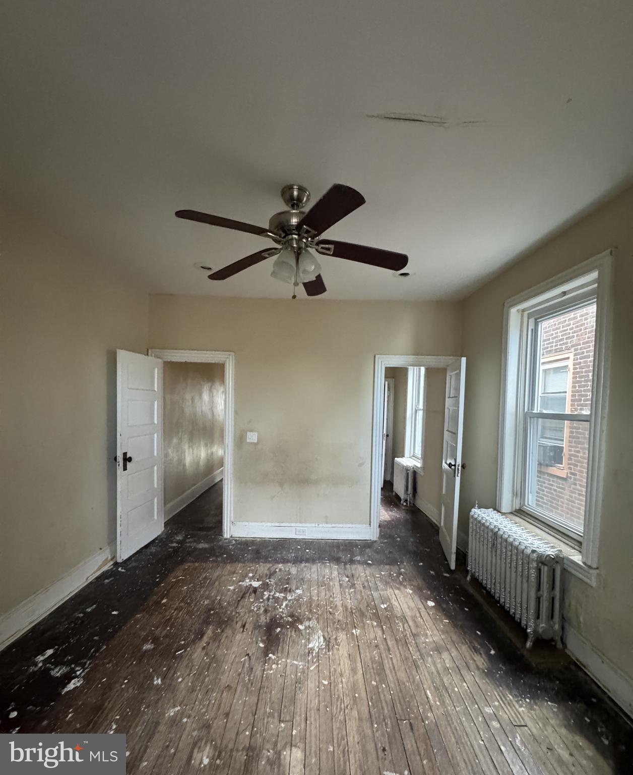 4935 Pulaski Avenue Philadelphia, PA 19144 - Photo 15 of 22 a view of empty room with wooden floor and fan
