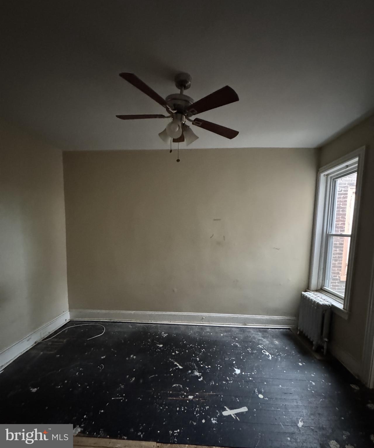4935 Pulaski Avenue Philadelphia, PA 19144 - Photo 18 of 22 an empty room with a window and a ceiling fan