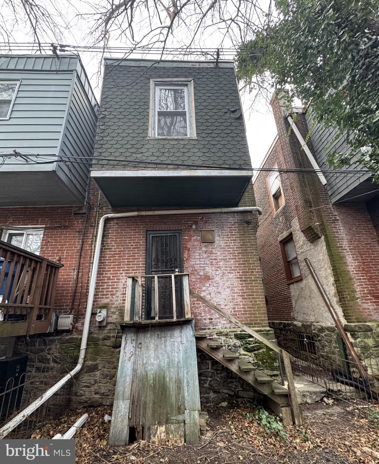 4935 Pulaski Avenue Philadelphia, PA 19144 - Photo 22 of 22 a view of a house with a wooden door