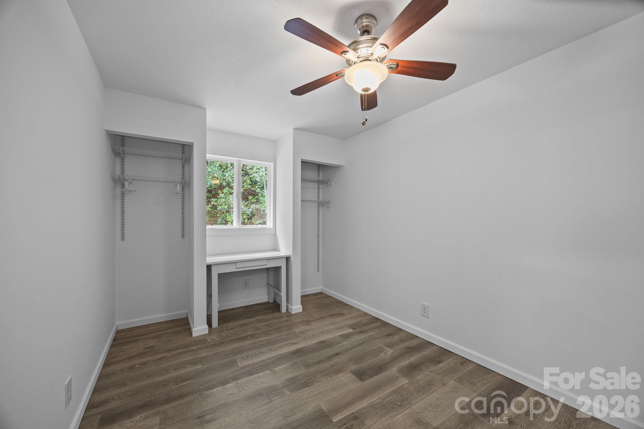 263 Morgan Branch Road, Unit 1 Leicester, NC 28748 - Photo 22 of 31 an empty room with a window and a ceiling fan