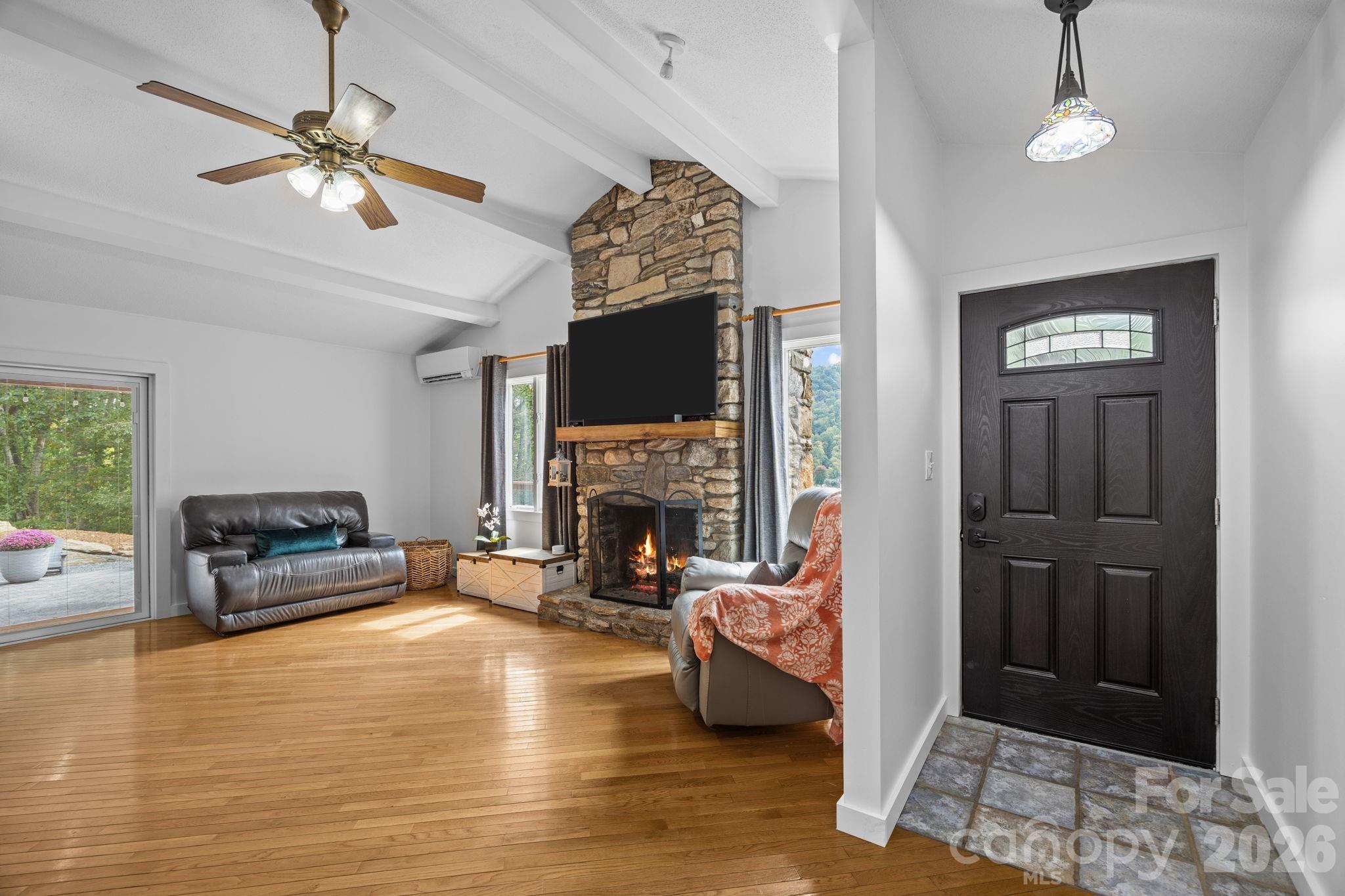 263 Morgan Branch Road, Unit 1 Leicester, NC 28748 - Photo 6 of 31 a living room with furniture and a fireplace