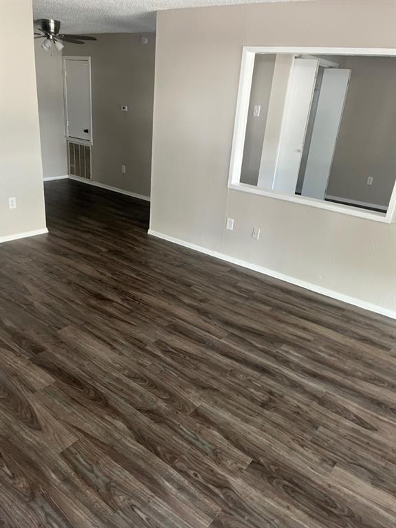 9696 Walnut Street, Unit 303 Dallas, TX 75243 - Photo 2 of 3 an empty room with wooden floor and windows