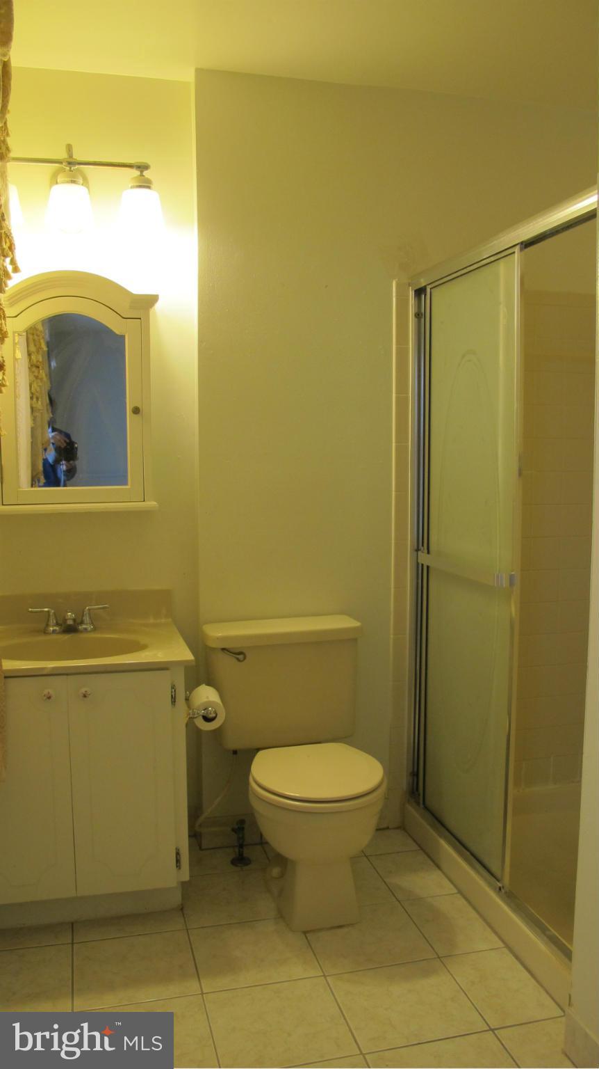 2902 Seminole Road Woodbridge, VA 22192 - Photo 12 of 24 a bathroom with a toilet and a shower