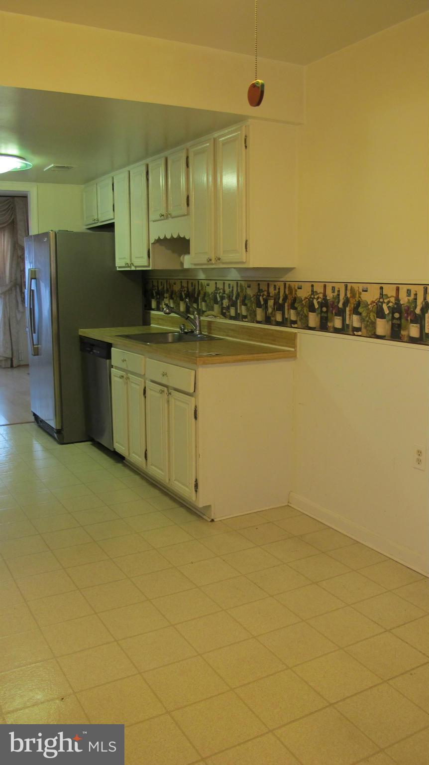 2902 Seminole Road Woodbridge, VA 22192 - Photo 17 of 24 a bathroom with a sink and a mirror