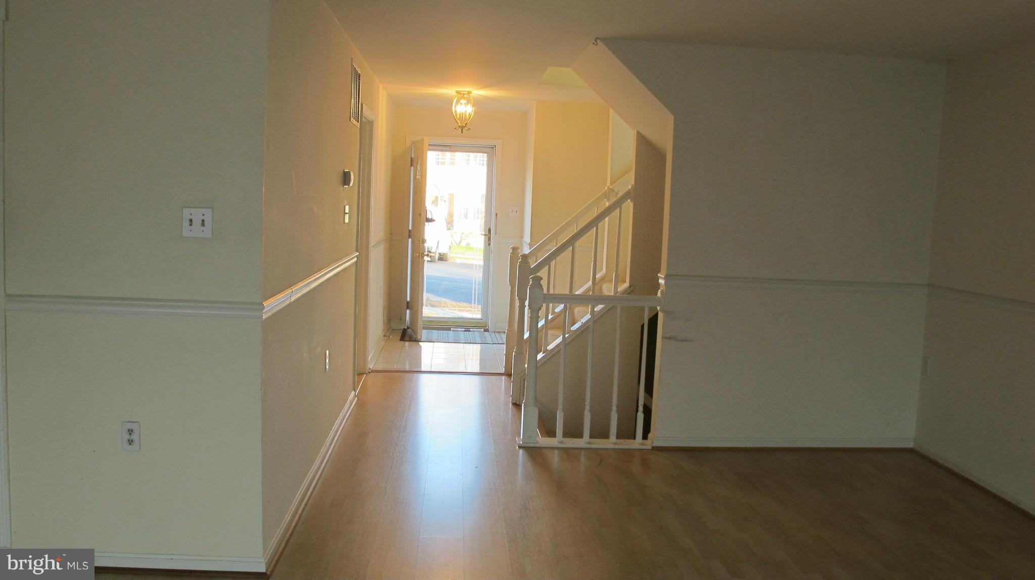 2902 Seminole Road Woodbridge, VA 22192 - Photo 6 of 24 a view of a hallway with wooden floor