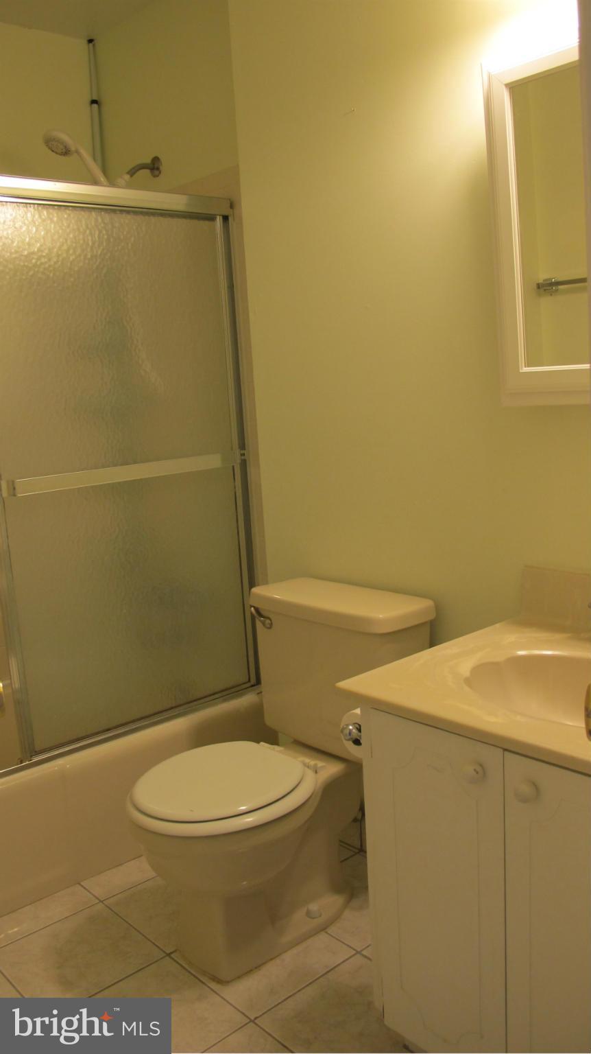 2902 Seminole Road Woodbridge, VA 22192 - Photo 10 of 24 a white toilet sitting next to a shower