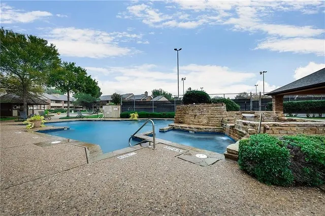 a view of swimming pool with seating space and furniture