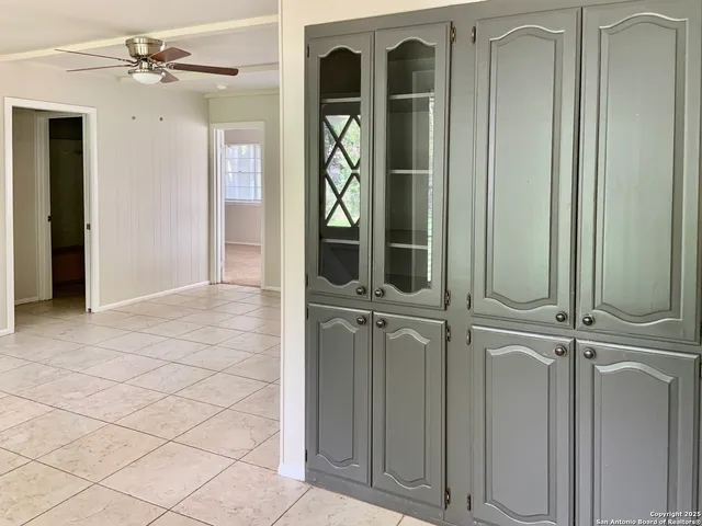 a bathroom with a sink vanity and a mirror