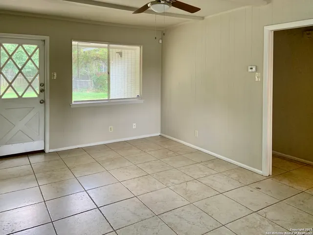 a view of an empty room with a window