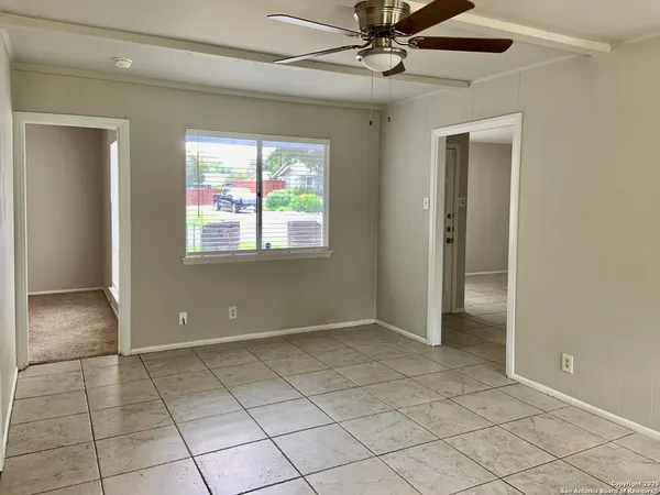 a view of an empty room with a window