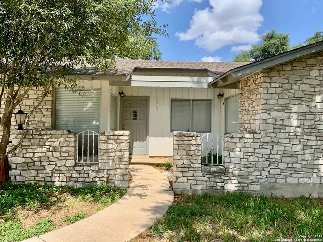 a view of house with backyard of the house