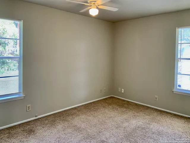 a house that has a tree in front of it