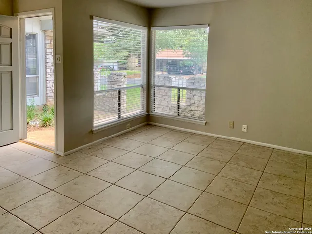 a view of an empty room and window