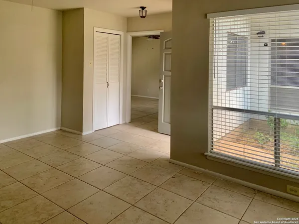 a view of a room that has a window in it