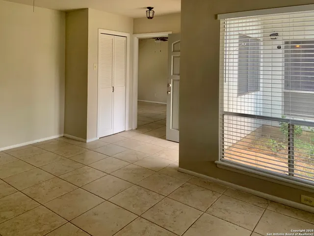 a view of a room that has a window in it