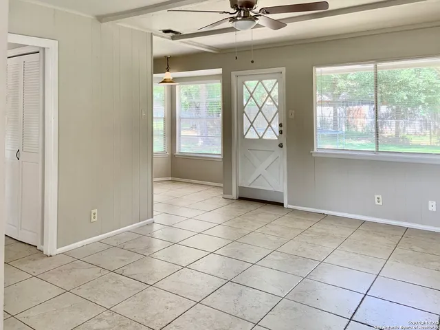 a view of an empty room and window