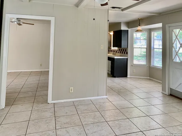 a view of a utility room and window in a room