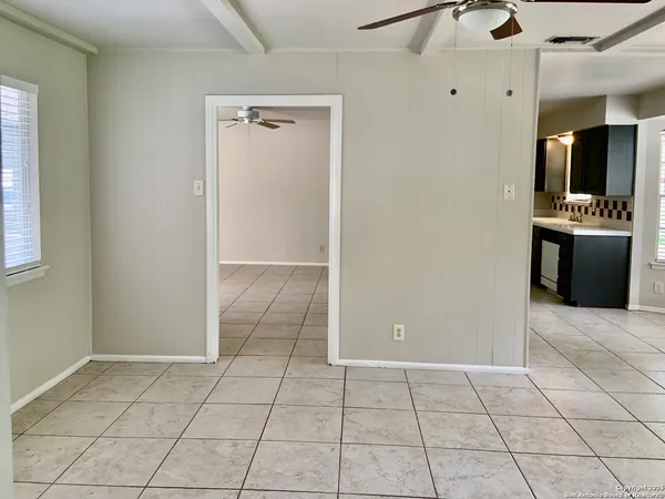 a kitchen with stainless steel appliances granite countertop a refrigerator and a stove