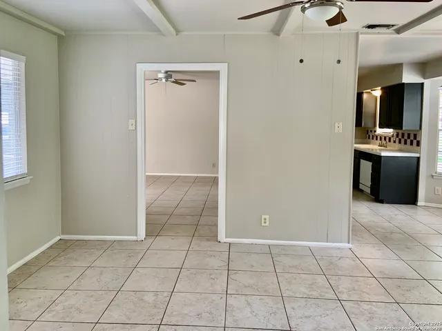 a kitchen with stainless steel appliances granite countertop a refrigerator and a stove