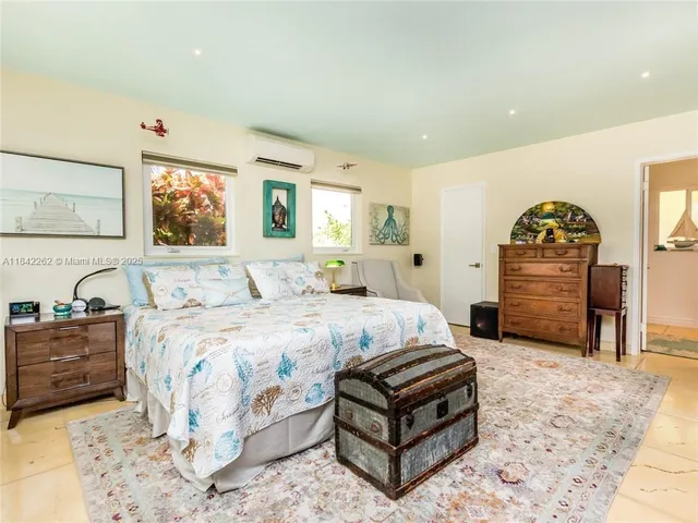 a bed room with a bed and a television