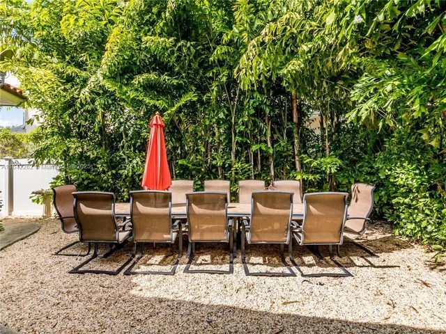 a view of a sitting area with furniture and wooden floor