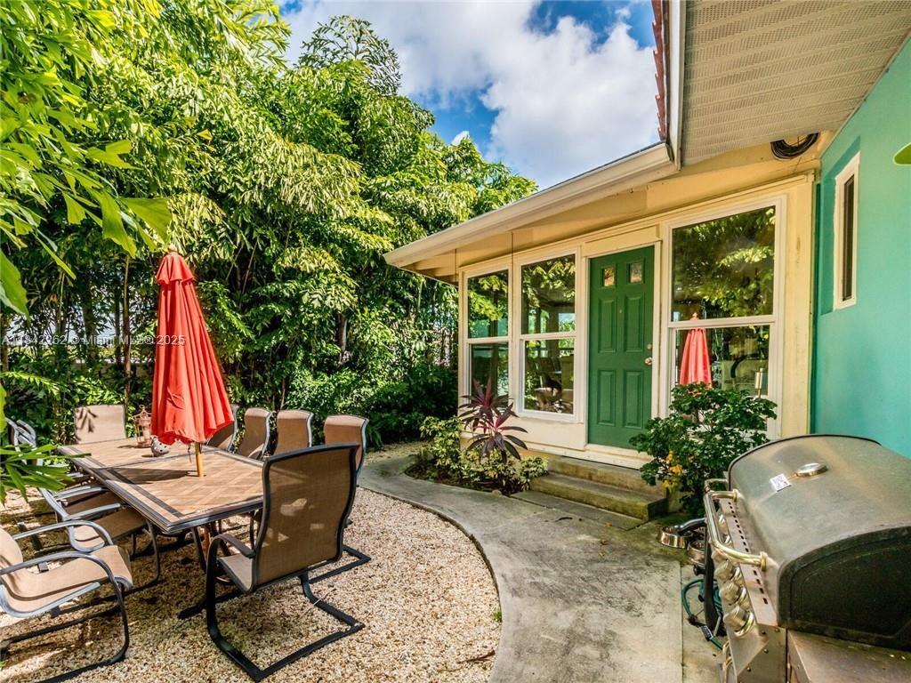 2616 Northeast 26th Avenue Lighthouse Point, FL 33064 - Photo 25 of 30 a view of a backyard with sitting area and furniture