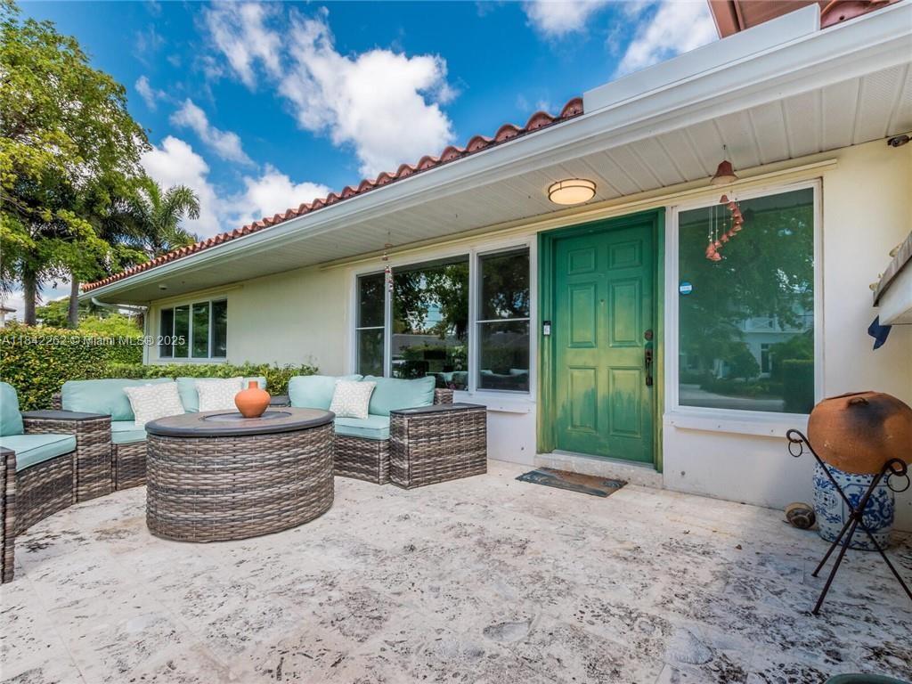 2616 Northeast 26th Avenue Lighthouse Point, FL 33064 - Photo 3 of 30 a house view with a sitting space and garden