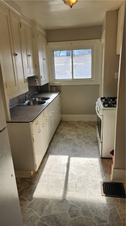 875 West Elm Street Decatur, IL 62522 - Photo 9 of 12 a bathroom with a granite countertop sink toilet and a bathtub