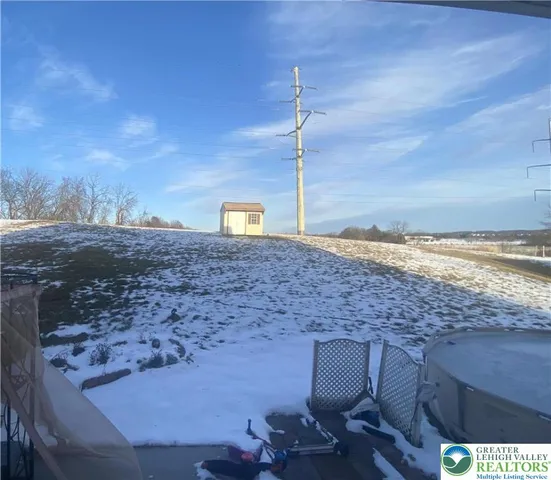 a view of a terrace with a table and chairs