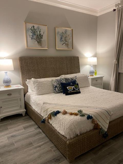 16 Harbour Isle Drive West, Unit 304 Fort Pierce, FL 34949 - Photo 12 of 17 a bedroom with bed and painting on the wall