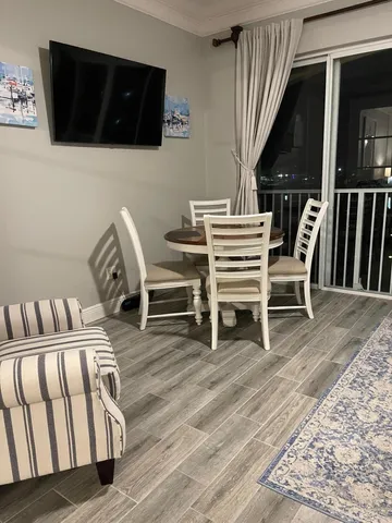 a view of a livingroom with furniture and staircase