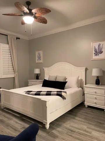 a bedroom with bed and window