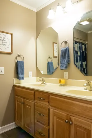 a kitchen with stainless steel appliances granite countertop a refrigerator and wooden cabinets