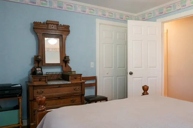 a view of staircase with white walls and a window