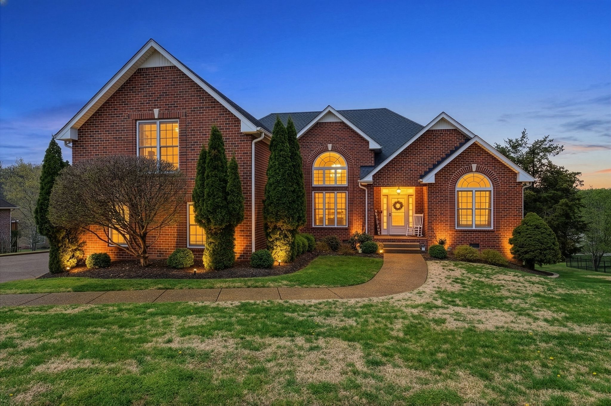 130 Cedar Ridge Lane Hendersonville, TN 37075 - Photo 1 of 37 a front view of a house with garden