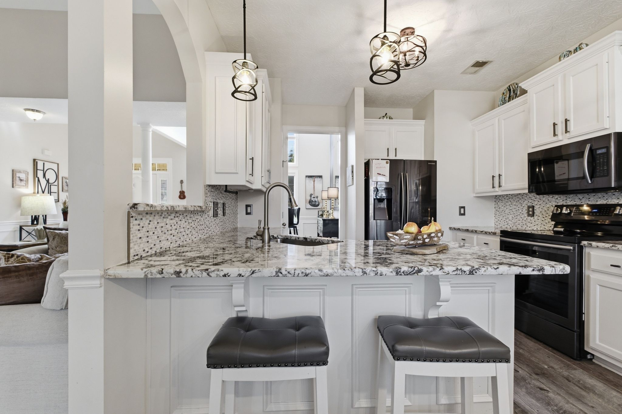 130 Cedar Ridge Lane Hendersonville, TN 37075 - Photo 11 of 37 a kitchen with stainless steel appliances granite countertop a sink a stove a refrigerator cabinets and chairs