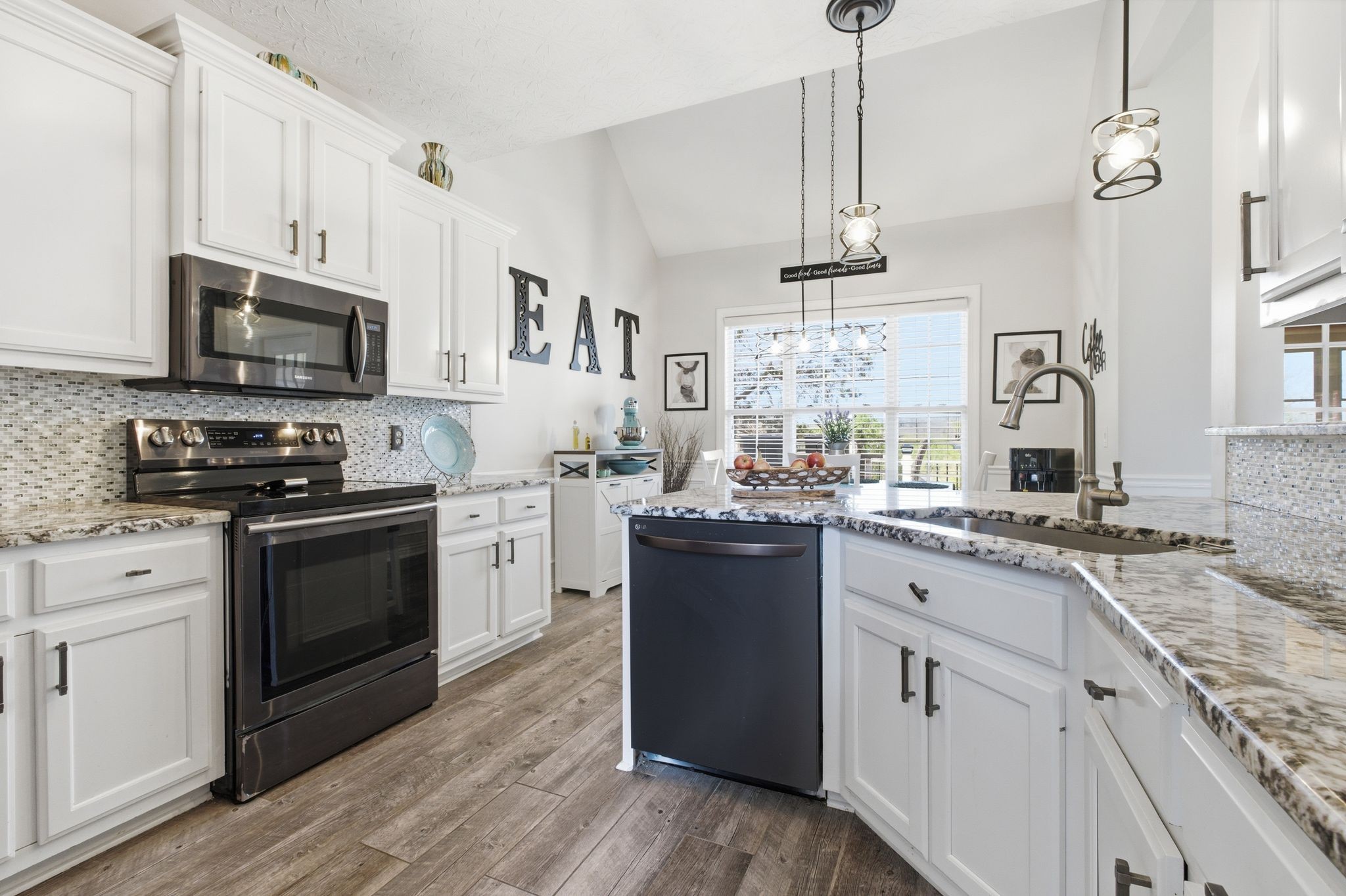 130 Cedar Ridge Lane Hendersonville, TN 37075 - Photo 13 of 37 a kitchen with stainless steel appliances granite countertop a stove top oven a sink dishwasher and a refrigerator with wooden floor