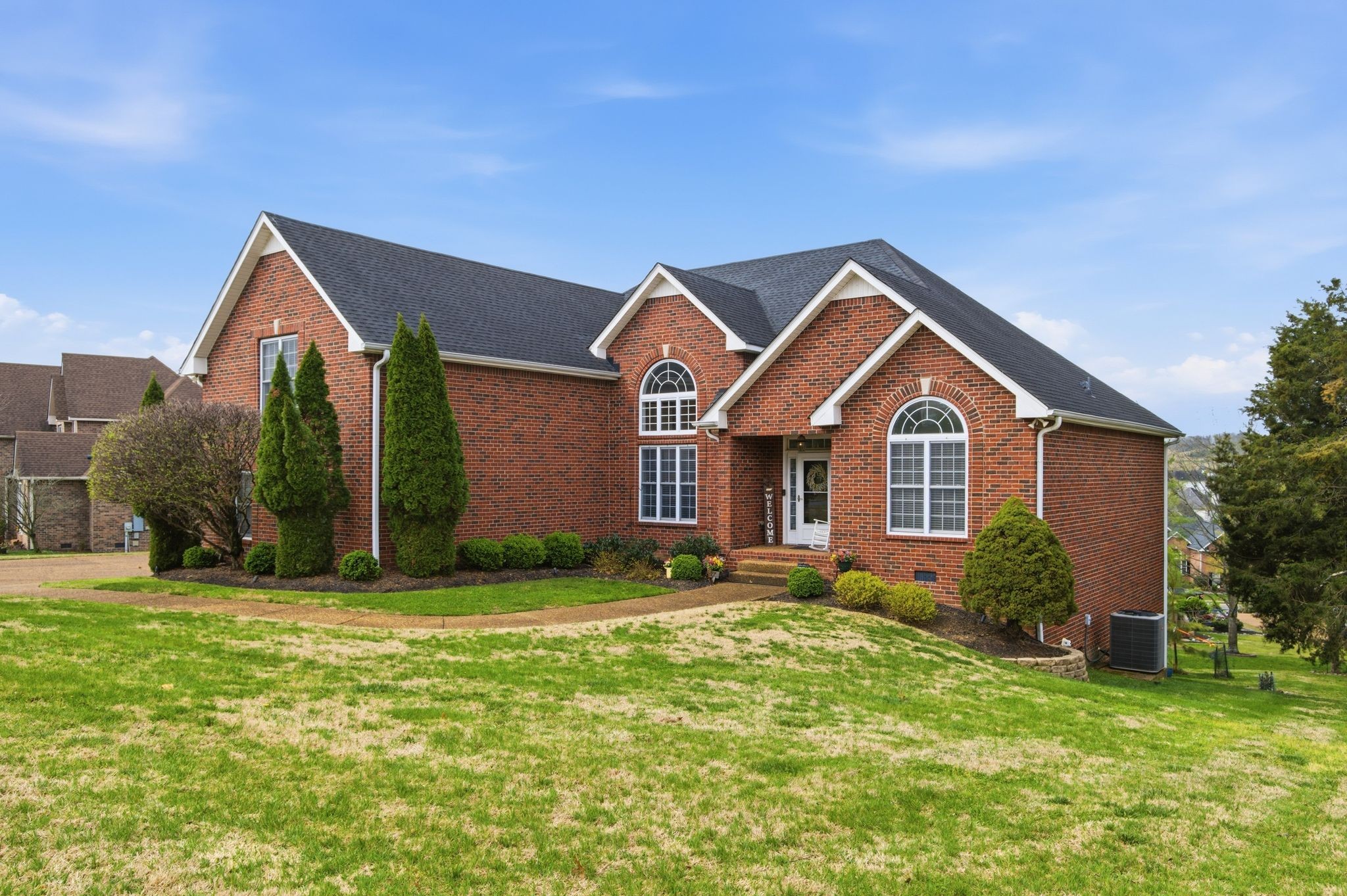 130 Cedar Ridge Lane Hendersonville, TN 37075 - Photo 2 of 37 a front view of a house with a yard and garage