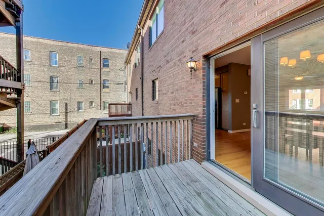 a view of a porch with chairs and table in the patio