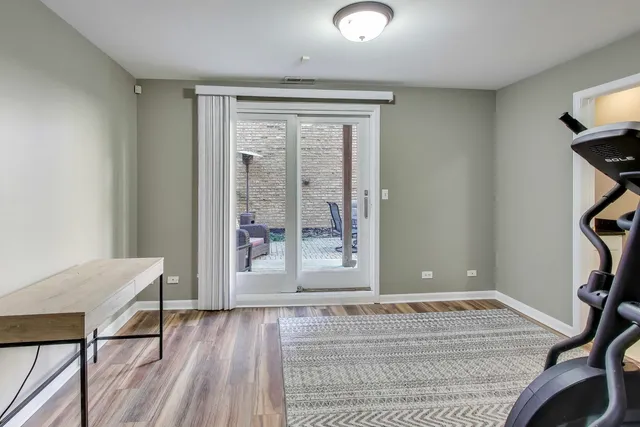 a dining room with wooden floor and breakfast area